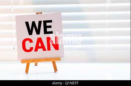 Motivational Concept Image of message note paper pinned on cork board with Yes You Can words written on it Stock Photo