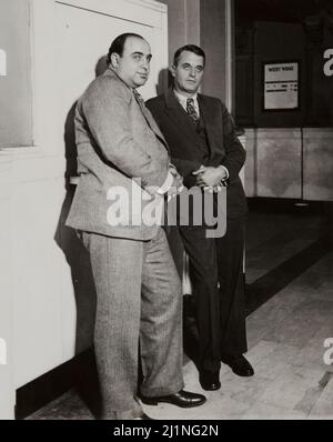 Al Capone with his lawyer Michael Ahern, awaits the Verdict. News Photograph 1931. Illinois Federal Court outside the trial room. The end of an era. Stock Photo