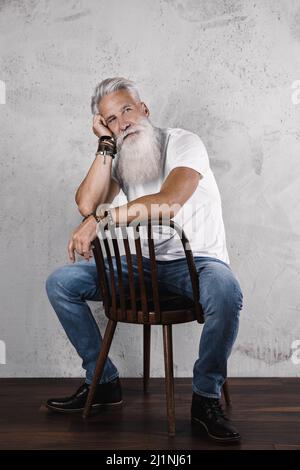 Handsome bearded senior man posing in studio Stock Photo