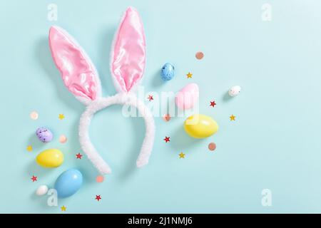 Background with rabbit ears and Easter eggs. Stock Photo