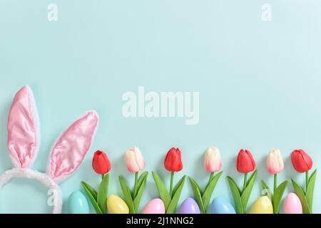 Easter banner with flowers, eggs and ears. Background with rabbit ears Stock Photo