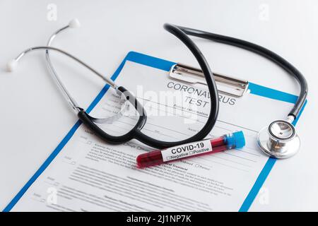 Blood samples and stethoscope on white background Stock Photo