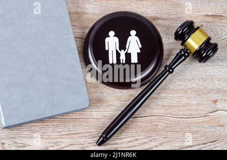 The Family figure and gavel on table. Family law concept Stock Photo