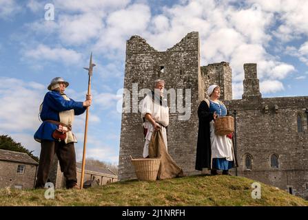 15th century re-enactors in the grounds of Bolton Castle near to Leyburn in North Yorkshire, watch as re-enactors bring alive the story of the Battle of Towton, which took place on March 29th, 1461 at a small village near to York called Towton. Picture date: Sunday March 27, 2022. Stock Photo