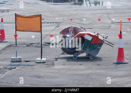 Construction work. Concrete floor cutting machine at the construction site. Stock Photo