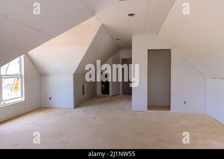 Working process of installing plasterboard drywall for making gypsum walls in room Stock Photo