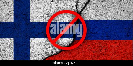 Finland and Russia flags. Cracked wall, conflict concept. Blocked and banned Russian railways background photo Stock Photo