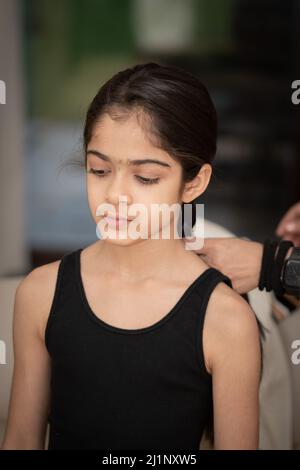 Attractive Indian teenager girl age aged 18 years old wearing a pink
