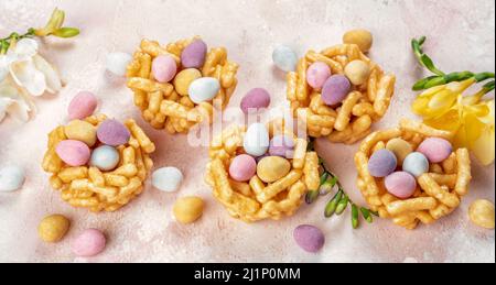 Springtime sweet nests filled with Easter eggs Stock Photo