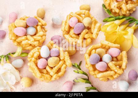 Springtime sweet nests filled with Easter eggs Stock Photo