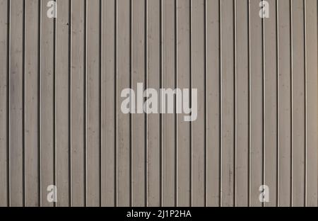 a rustic background of a wall made of gray painted wooden planks Stock Photo