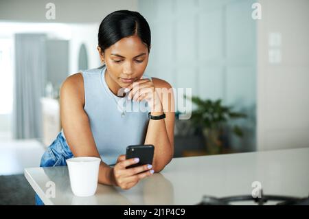 Contemplative woman with smart phone leaning on electric car Stock ...