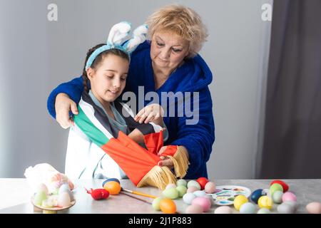 grandmother and granddaughter with uae flag for easter Stock Photo