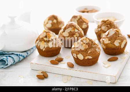 Muffins with flaked almond nuts. Cupcakes with nut chips Stock Photo