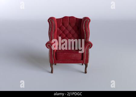 red velvet wing chair on white background, 3d rendering Stock Photo