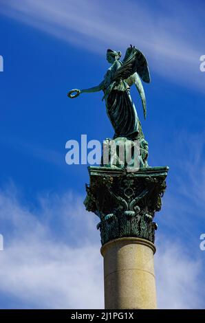 Stuttgart, Baden-Württemberg, Germany: Sculpture of an angel and four lions on a pillar, Jubilee Pillar (Jubiläumssäule) on Schlossplatz Square. Stock Photo