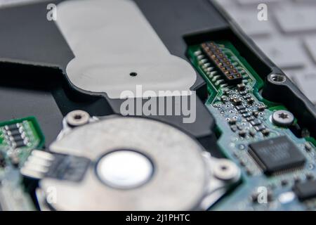 Laptop and notebook data storage components like hdd, hard disk drive, ram memory show data backup, data security and technical archive solutions Stock Photo