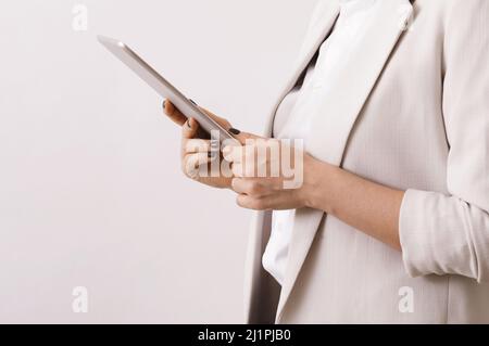 Businesswoman's hands with a modern tablet pc Stock Photo