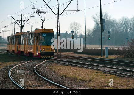 Warsaw. Poland. 03.22.2022. Yellow tram at the fork in the tracks. Stock Photo