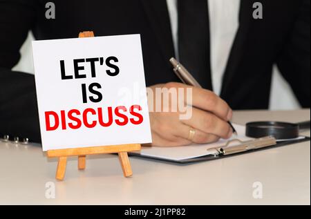 Handwriting text Let S Discuss. Concept meaning asking someone to talk about something with demonstrating or showing Flat lay above table with pc keyb Stock Photo