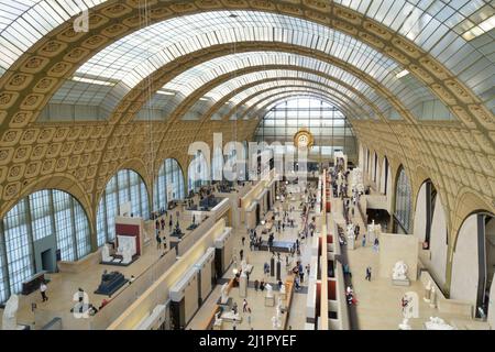 Paris, France - March 22, 2022: Visitors at the Musee d'Orsay in Paris. Located in the former Gare d'Orsay train station, the museum has the largest c Stock Photo
