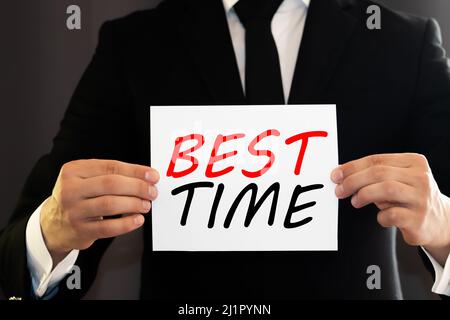 Black color felt letter board with white alphabet in word best time background. Stock Photo