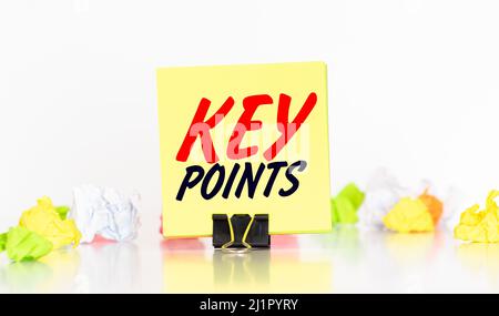 blank note pad with KEY POINTS text on green wooden background. Stock Photo