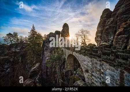 The bridge of the rock formation Bastei in Rathen area of the Saxon Switzerland National Park at sunrise. Stock Photo