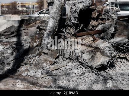 pieces of reinforcement of the destroyed bridge.  ruins of concrete structures. Dismantling of concrete structures Stock Photo