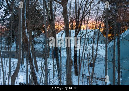 Snow covered house in snow at sunset Stock Photo