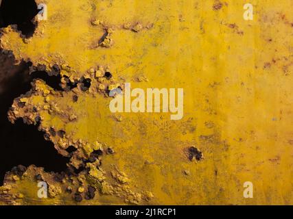 Black and yellow painted old grungy corroded weathered Metal sheet surface texture background. Space for text, title. Stock Photo