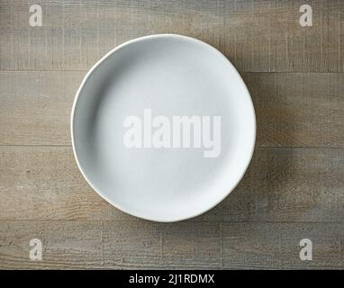 empty plate on wooden table, top view Stock Photo