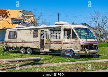 ARABI, LA, USA - MARCH 26, 2022: Severely storm-damaged Winnebago with for sale sign in neighborhood ravaged by tornado of March 22, 2022 Stock Photo