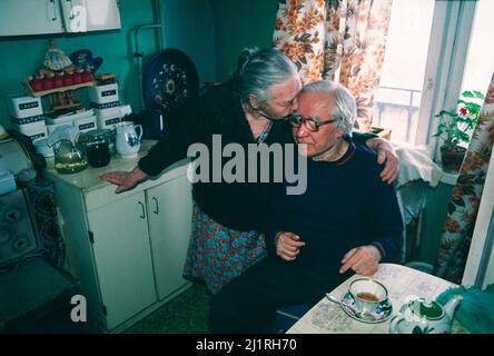 A Russian couple in their 90’s living on a 200 Ruble a month pension in their kitchen in Moscow in late 1991. Stock Photo
