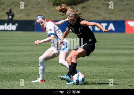 Angel City FC midfielder Dani Weatherholt (17) is defended by OL Reign midfielder Rose Lavelle (16) during a NWSL match, Saturday, March 26, 2022, at Stock Photo