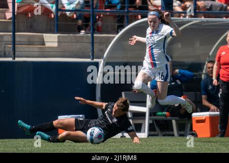OL Reign midfielder Rose Lavelle (16) avoids a slide tackle by Angel City FC midfielder Savannah McCaskill (9)during a NWSL match, Saturday, March 26, Stock Photo