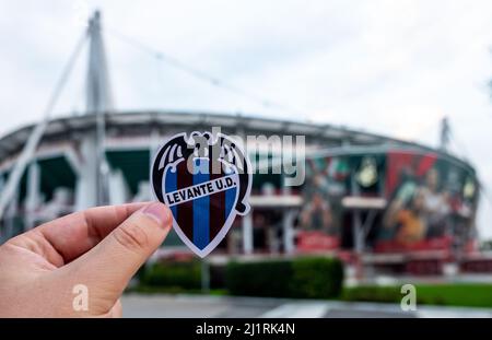 August 30, 2021, Valencia, Spain. The emblem of the football club Levante UD against the background of a modern stadium. Stock Photo