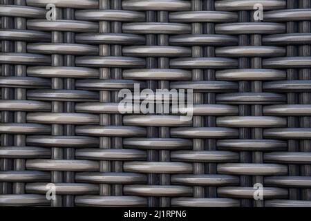Detail of a grey braiding of a chair made of woven plastic Stock Photo