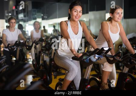 People warming up by exercise bikes in 