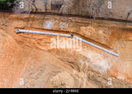 Aerial top layer pipes installation of underground utilities on drainage system Stock Photo