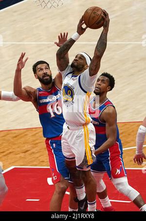 Golden State Warriors guard Gary Payton II (0) shoots next to Denver ...