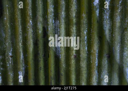 Rusted, stained and weathered galvanized blue iron plate with folds like drapes Stock Photo