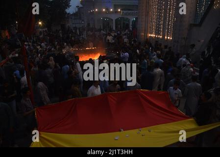 Lahore, Punjab, Pakistan. March 27, 2022, Lahore, Punjab, Pakistan: Pakistani devotees attend the three-days 434th annual Urs 'Festival of lights' at the shrine of Muslim Sufi saint Shah Hussain, popularly known as Madho Lal Hussain in Lahore. The annual 3 days festival was held at Madhu Lal's shrine on his 434th birth anniversary. Mela Charaghan has its own importance in Lahore's history, as it has been a biggest festival of Lahore in some times.The festival was started with the seasonal Baisakhi festival in old times. Credit: ZUMA Press, Inc./Alamy Live News Credit: ZUMA Press, Inc./Alamy Li Stock Photo