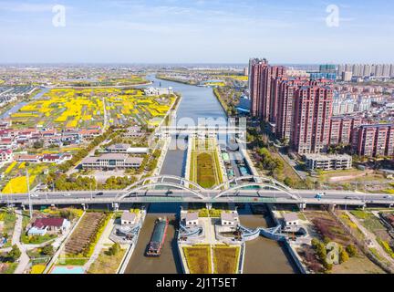 NANTONG, CHINA - MARCH 28, 2022 - Ships pass through Haian Lock in Nantong, East China's Jiangsu Province, March 28, 2022. Stock Photo