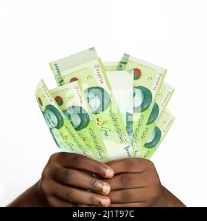 Black Hands Holding 3d Rendered 50000 Ugandan Shilling Notes. Closeup 