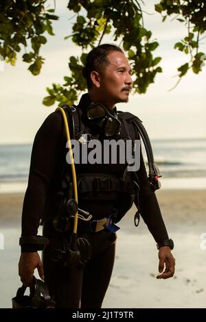 diver rescue in wetsui  equipment for scuba diving. The concept of sports, recreation, travel. Stock Photo