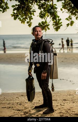 diver rescue in wetsui  equipment for scuba diving. The concept of sports, recreation, travel. Stock Photo