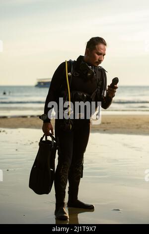 diver rescue in wetsui  equipment for scuba diving. The concept of sports, recreation, travel. Stock Photo