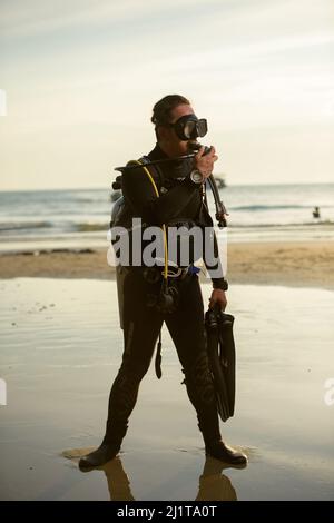 diver rescue in wetsui  equipment for scuba diving. The concept of sports, recreation, travel. Stock Photo