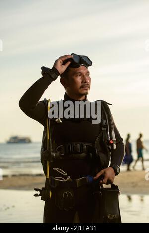 diver rescue in wetsui  equipment for scuba diving. The concept of sports, recreation, travel. Stock Photo